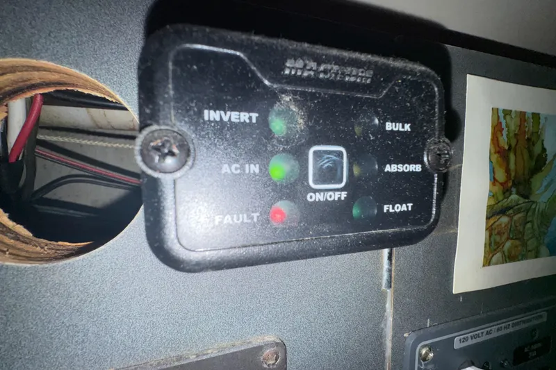 Slide: The Image of Control panel on a 1994 Beneteau 40 yacht, featuring various indicator lights. - 98