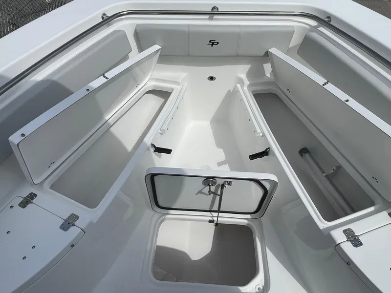 Slide: The Image of 2025 Sea Pro 222 Center Console boat interior with open storage compartments. - 15