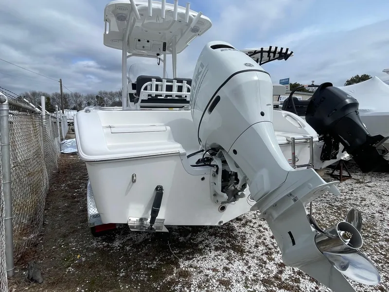 Slide: The Image of 2025 Sea Pro 222 Center Console boat with powerful outboard motor, parked outdoors. - 4