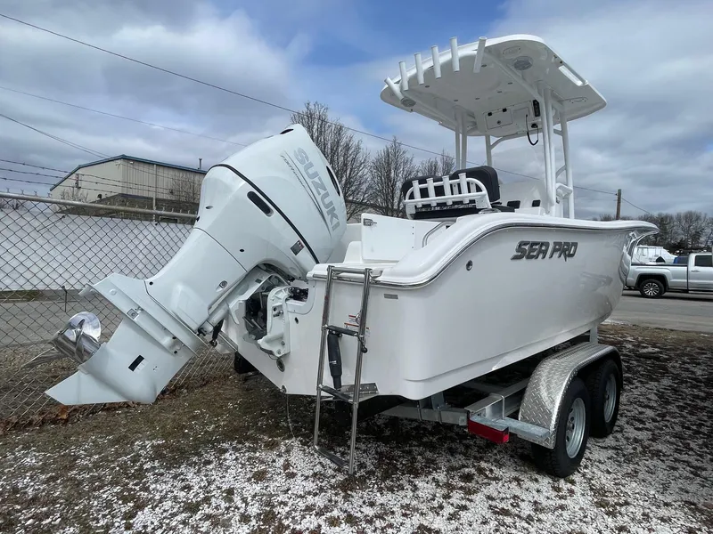 Slide: The Image of 2025 Sea Pro 222 Center Console boat on trailer, featuring a powerful outboard motor. - 6