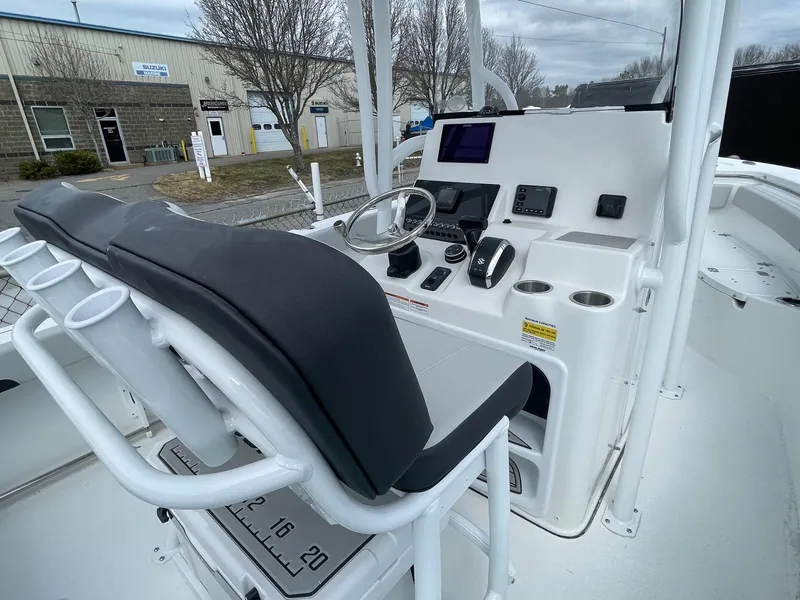 Slide: The Image of 2025 Sea Pro 222 Center Console boat interior with steering wheel and control panel. - 8