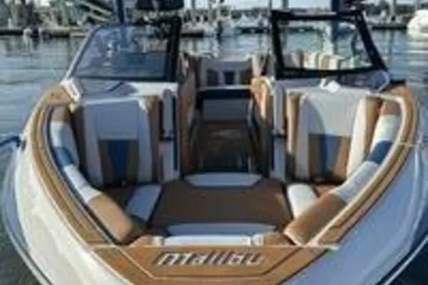 Slide: The Image of 2023 Malibu Wakesetter 23 LSV boat with stylish interior at a marina. - 6
