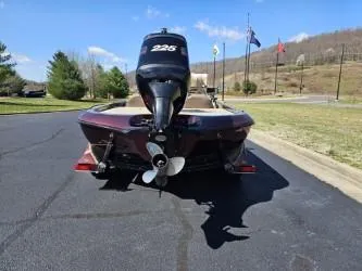 Slide: The Image of 2000 Ranger 520VX boat with outboard motor on a sunny day. - 3