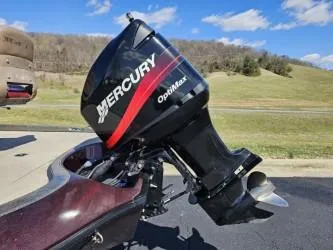 Slide: The Image of 2000 Ranger 520VX boat with Mercury OptiMax engine on a sunny day. - 8