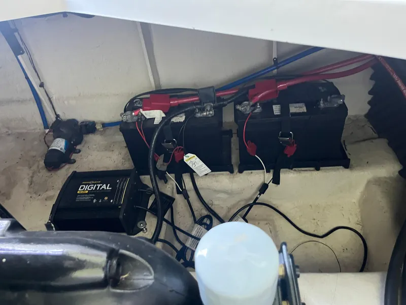 Slide: The Image of Engine compartment of 2014 Sea Ray 240 Sundancer with batteries and wiring. - 23