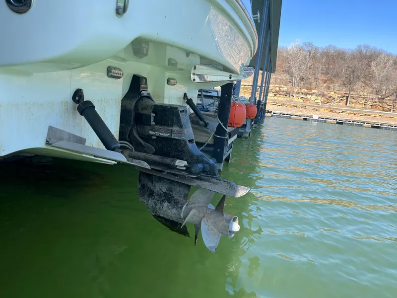 Slide: The Image of 2014 Sea Ray 240 Sundancer boat stern with propeller in water. - 27