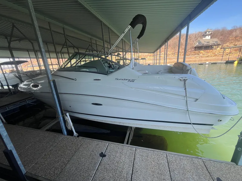 Slide: The Image of 2014 Sea Ray 240 Sundancer docked under covered marina. - 3