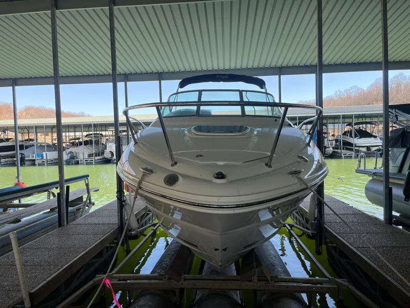 Slide: The Image of 2014 Sea Ray 240 Sundancer docked in a covered marina. - 4