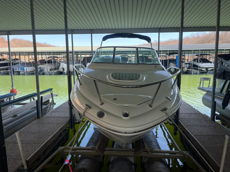 Slide: The Image of 2014 Sea Ray 240 Sundancer docked in a covered marina. - 5