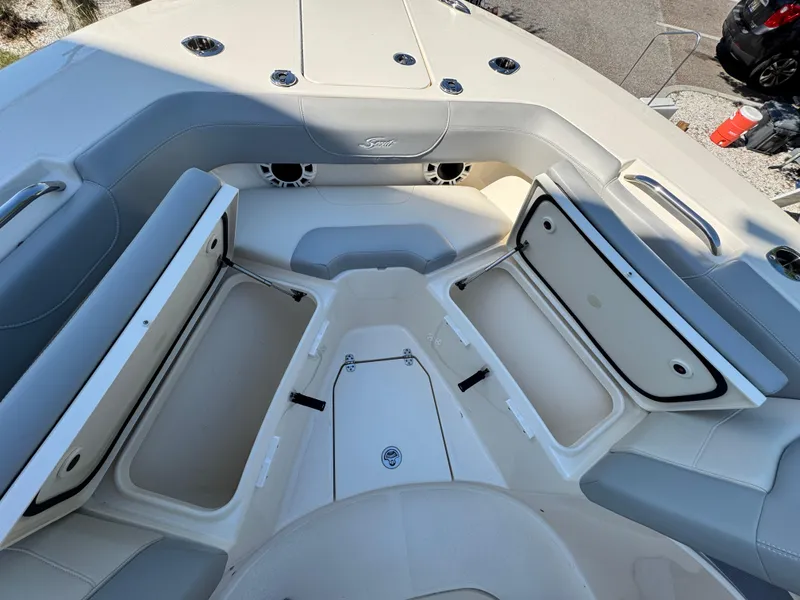 Slide: The Image of 2023 Scout 305 LXF boat interior with open storage compartments. - 16