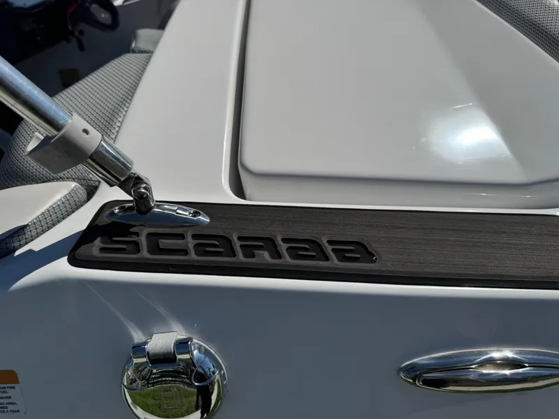 Slide: The Image of 2022 Scarab 165 ID boat detail with logo and hardware. - 10