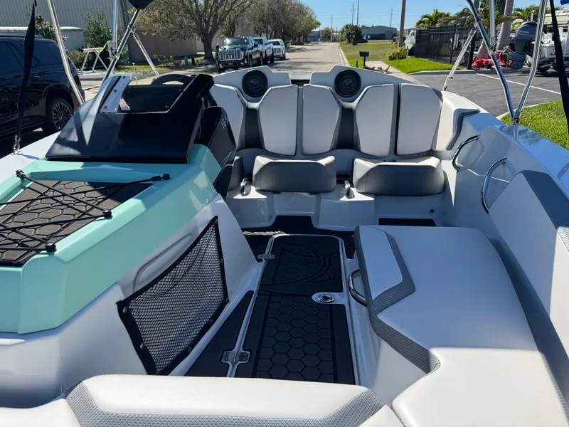 Slide: The Image of 2022 Scarab 165 ID boat interior with modern seating and dashboard. - 15