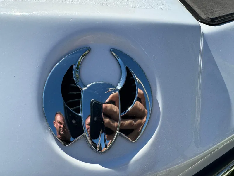 Slide: The Image of Chrome Scarab 165 ID logo on white surface, reflecting surroundings, 2022 model. - 18