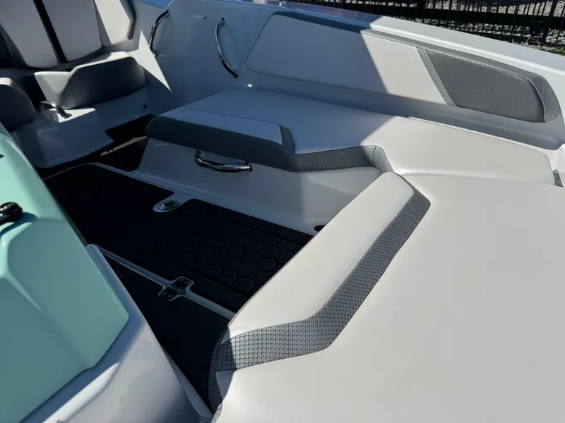 Slide: The Image of Interior seating of 2022 Scarab 165 ID boat with modern design and gray accents. - 19