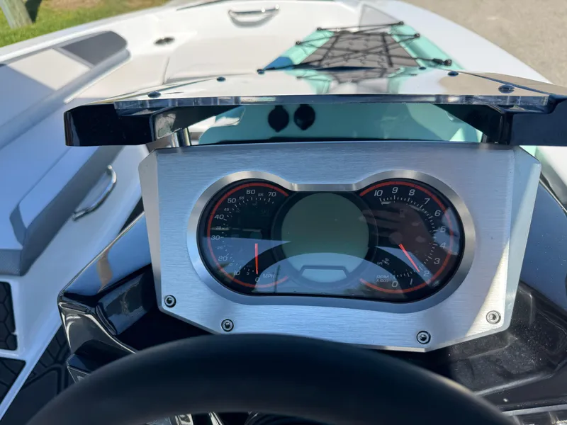Slide: The Image of Dashboard of a 2022 Scarab 165 ID boat with speedometer and tachometer. - 28
