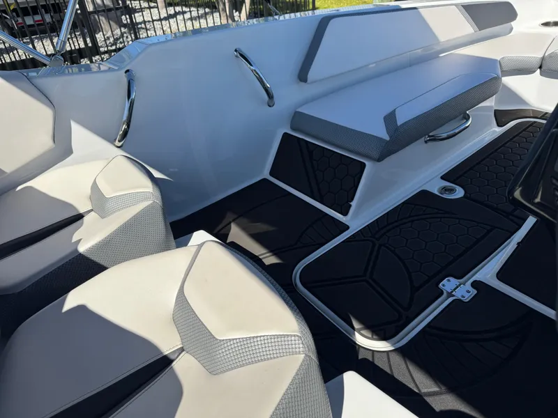 Slide: The Image of Interior of 2022 Scarab 165 ID boat with modern seating and sleek design. - 29
