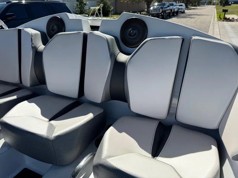 Slide: The Image of 2022 Scarab 165 ID boat interior with modern seating and integrated speakers. - 35