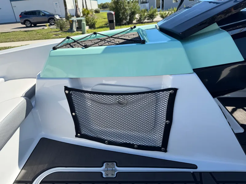 Slide: The Image of 2022 Scarab 165 ID boat interior with storage net and sleek design. - 37