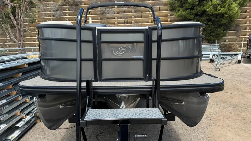 Slide: The Image of 2023 Barletta Lusso 23UC pontoon boat, rear view with ladder and sleek design. - 14