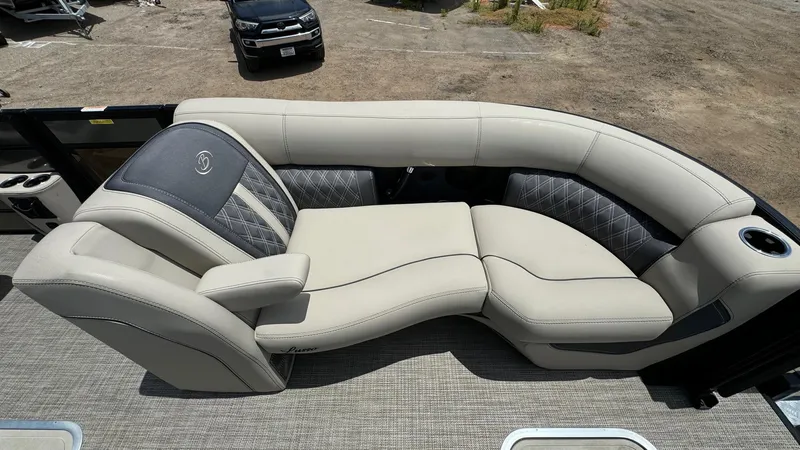 Slide: The Image of 2023 Barletta Lusso 23UC boat interior with luxurious seating and cup holder. - 17