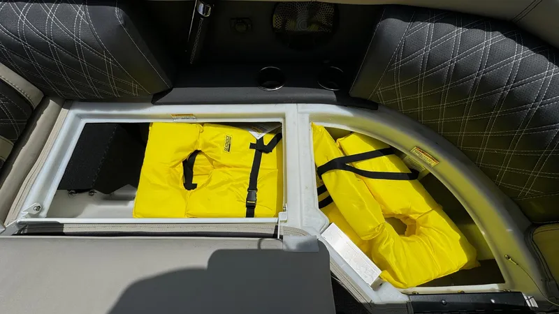 Slide: The Image of 2023 Barletta Lusso 23UC boat storage with yellow life jackets. - 19