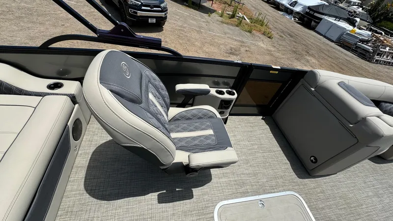 Slide: The Image of 2023 Barletta Lusso 23UC boat interior with luxurious seating and cup holders. - 20