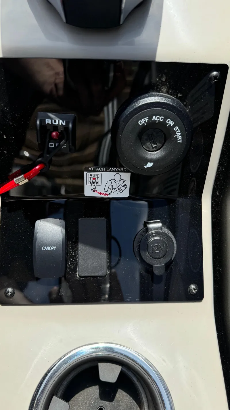 Slide: The Image of Control panel of 2023 Barletta Lusso 23UC boat with ignition and switches. - 33