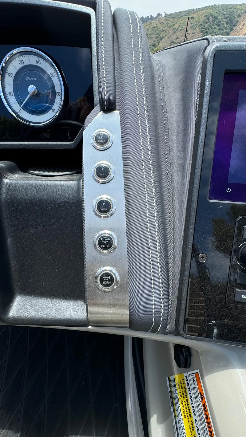 Slide: The Image of 2023 Barletta Lusso 23UC dashboard with control buttons and display screen. - 35