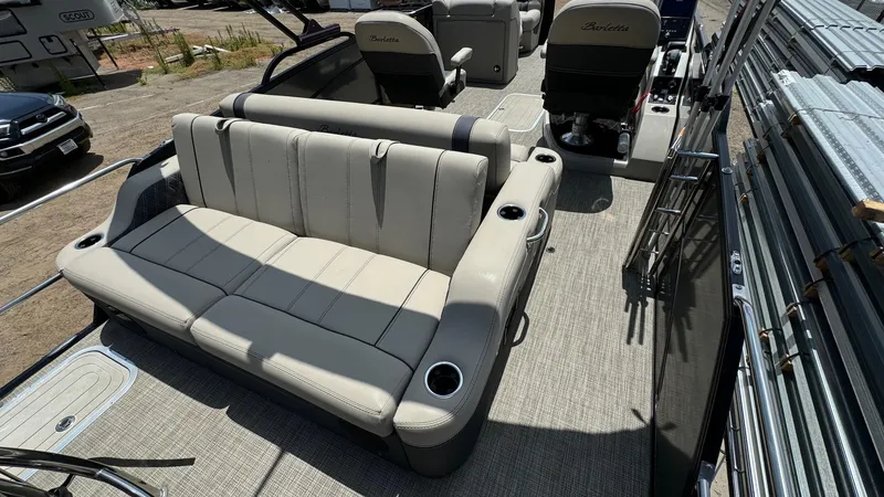 Slide: The Image of 2023 Barletta Lusso 23UC pontoon boat with luxurious seating and cup holders. - 39