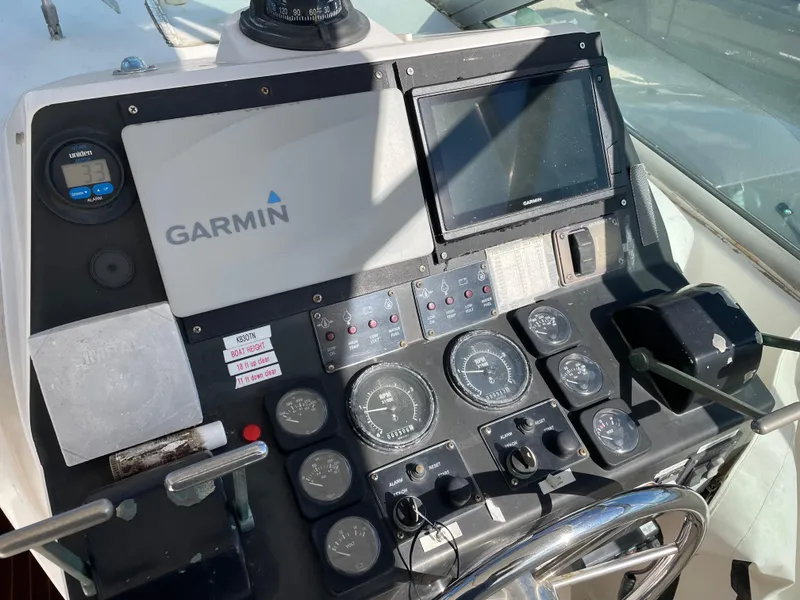 Slide: The Image of Control panel of a 1995 Bertram 30 Moppie boat with Garmin navigation system. - 4