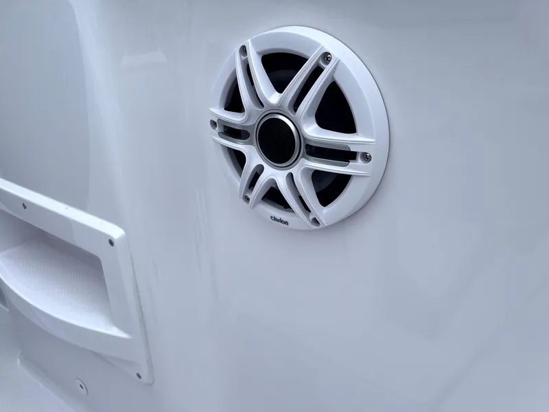 Slide: The Image of 2024 Axopar 22 boat speaker detail, white exterior, modern design. - 15