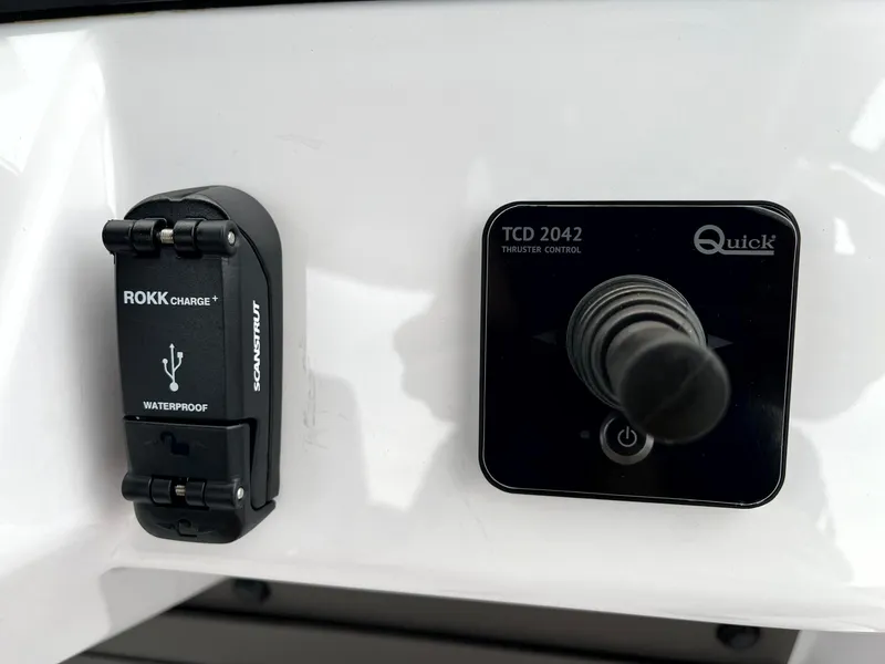 Slide: The Image of Control panel of 2024 Axopar 22 with ROKK Charge and Quick thruster control. - 16