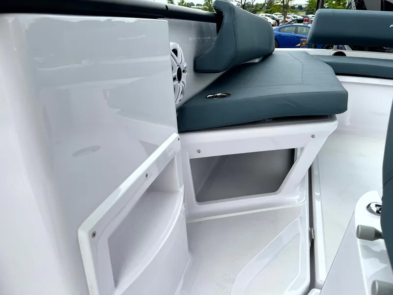 Slide: The Image of 2024 Axopar 22 boat interior with sleek seating and storage compartments. - 18
