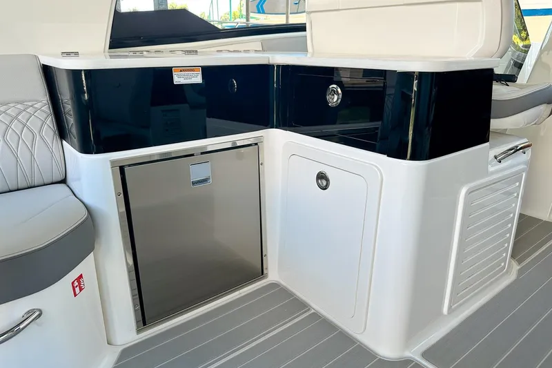 Slide: The Image of 2025 Sea Ray Sundancer 370 interior with sleek cabinetry and modern design. - 11