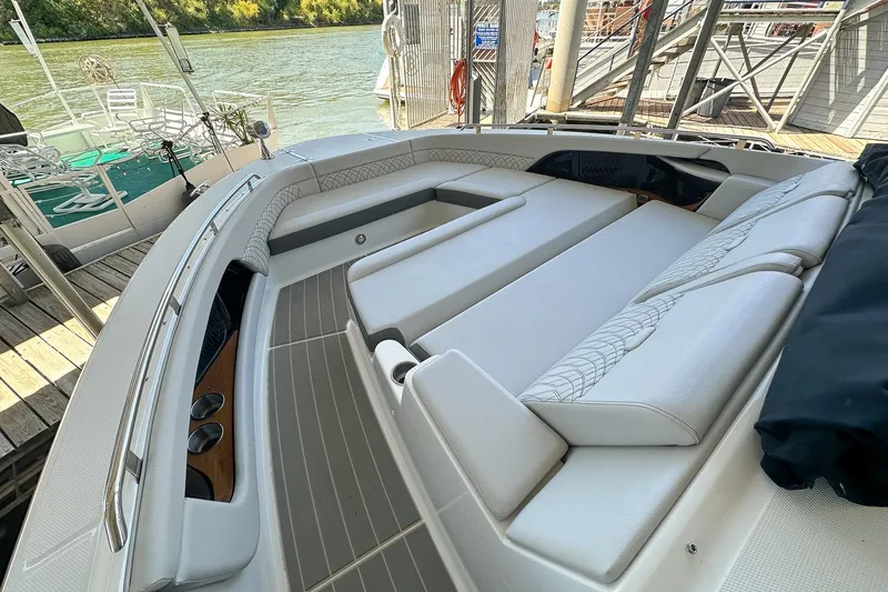 Slide: The Image of 2025 Sea Ray Sundancer 370 boat interior with luxurious seating and elegant design. - 42