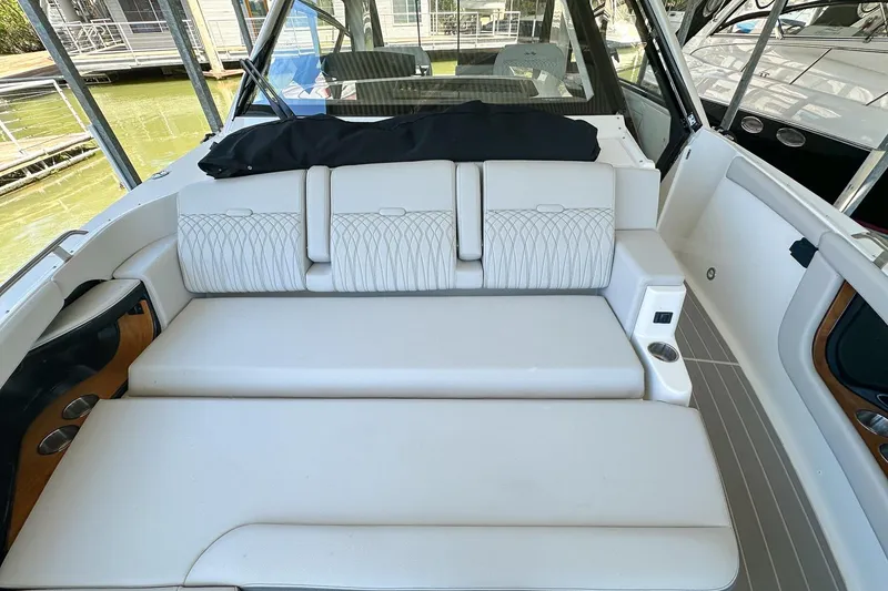 Slide: The Image of 2025 Sea Ray Sundancer 370 interior with white seating and modern design. - 43