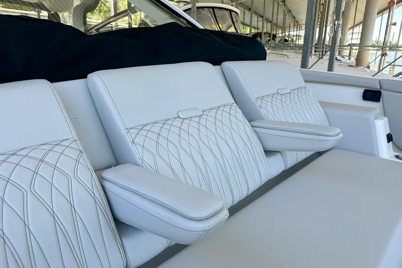 Slide: The Image of Luxurious seating on 2025 Sea Ray Sundancer 370 yacht, featuring elegant white upholstery. - 45