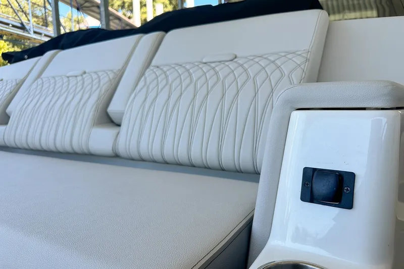 Slide: The Image of 2025 Sea Ray Sundancer 370 interior with luxurious white seating and modern design. - 46