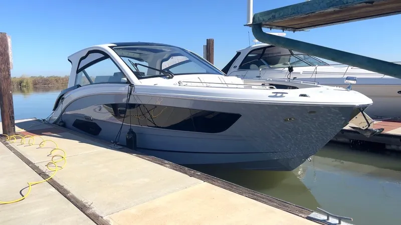 Slide: The Image of 2025 Sea Ray Sundancer 370 docked, showcasing sleek design and modern features. - 51
