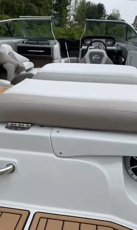 Slide: The Image of 2023 Crownline 240 SS boat interior with seating and dashboard view. - 15