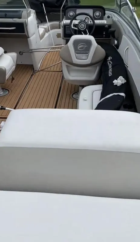 Slide: The Image of 2023 Crownline 240 SS boat interior with modern dashboard and seating. - 16