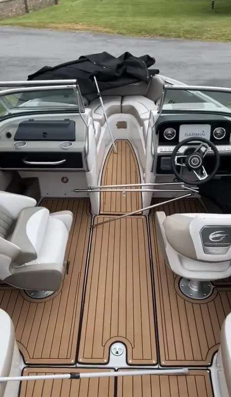 Slide: The Image of 2023 Crownline 240 SS boat interior with modern dashboard and seating. - 6