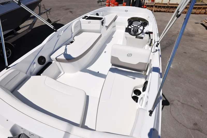 Slide: The Image of 2025 Hurricane SunDeck Sport 185 OB boat interior with seating and steering wheel. - 2