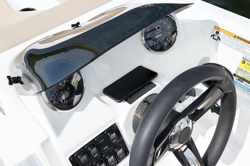 Slide: The Image of 2025 Hurricane SunDeck Sport 185 OB dashboard with steering wheel and gauges. - 26