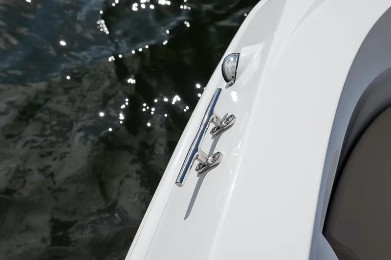 Slide: The Image of 2025 Hurricane SunDeck Sport 185 OB boat detail with cleat and water reflection. - 27