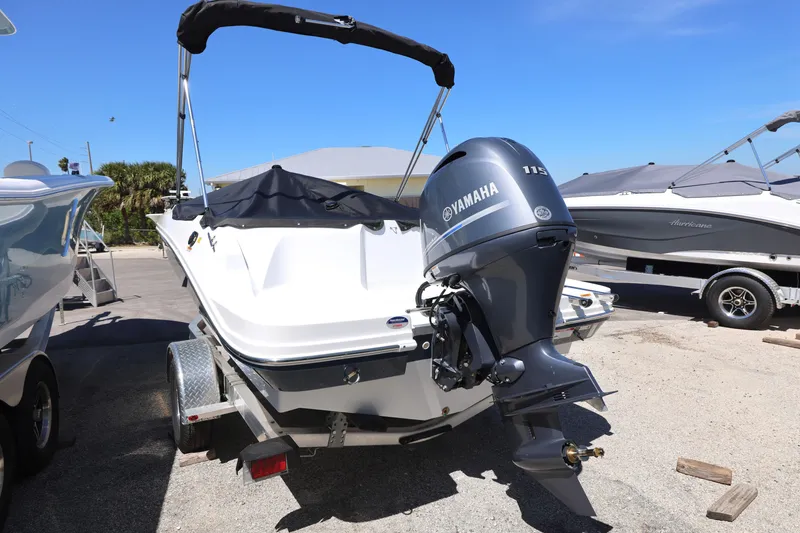 Slide: The Image of 2025 Hurricane SunDeck Sport 185 OB boat with Yamaha outboard motor on trailer. - 3