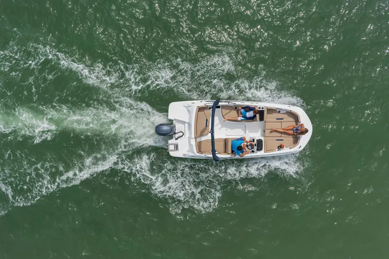 Slide: The Image of Aerial view of 2025 Hurricane SunDeck Sport 185 OB boat cruising on water. - 32