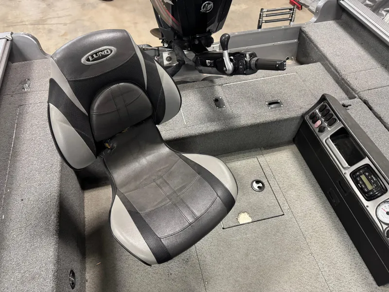 Slide: The Image of 2016 Lund 1875 Pro Guide boat interior with seat and control panel. - 11