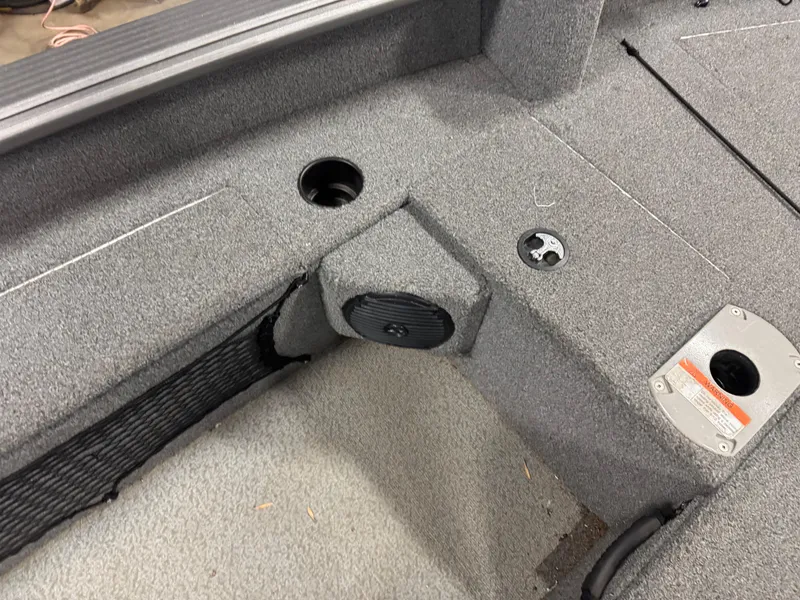 Slide: The Image of 2016 Lund 1875 Pro Guide boat interior with carpeted deck and storage compartments. - 4