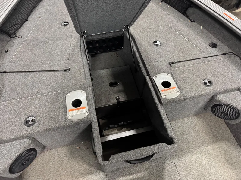 Slide: The Image of 2016 Lund 1875 Pro Guide boat interior with open storage compartments. - 5